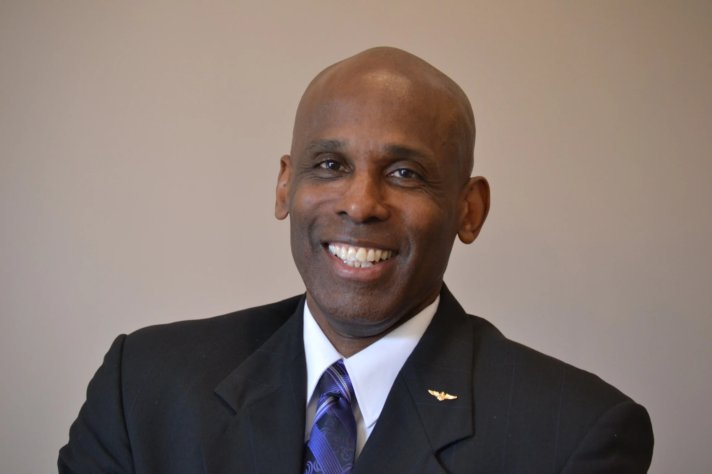 Carl smiling in a professional portrait